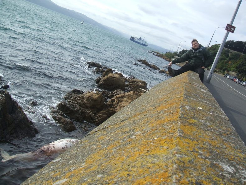 Anton pointing down to the washed up dead whale.