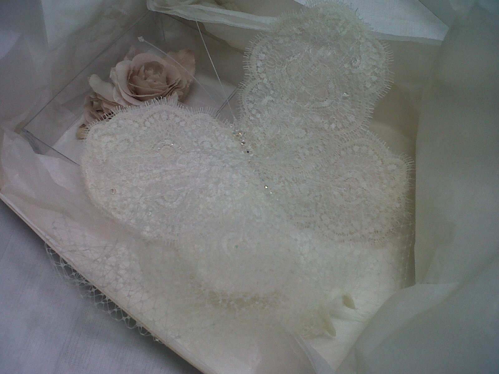 A handmade butterfly and flower completes Jane Yeh's delicate veil to perfection.