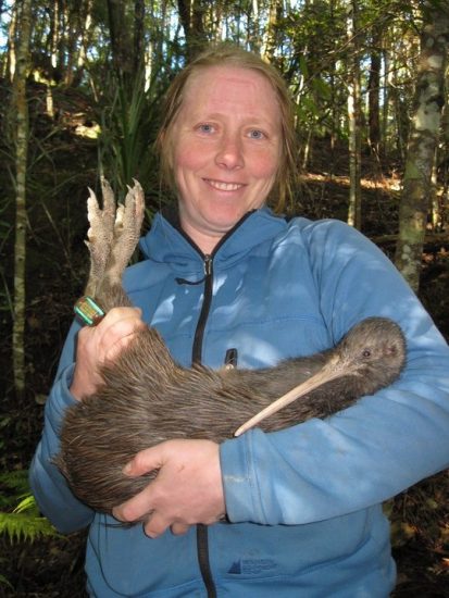 Te Papa researcher Sarah Jamieson with an adult female North Island brown kiwi. Photo credit: Kyle Morrison.
