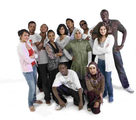 Group of refugee background youth posing for the camera.