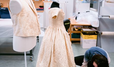 Textile conservator Anne Peranteau prepares William and Sarah Rhodes wedding waistcoat and dress for display. 27 Sept 2016. Te Papa