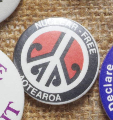 Badge with CND symbol with miha (fern shoots).