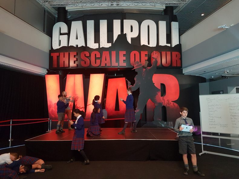 Students use 3D scanners to record their emotional responses outside Gallipoli: The Scale of Our War exhibition, Te Papa