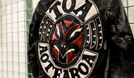 A patch on the back of a black leather jacket, the word 'Toa Aotearoa' are stitched on