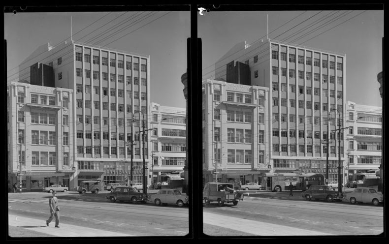 A black and white split image of the same street scene of 1960s Wellington buildings and cars. There is a man walking in the foreground.